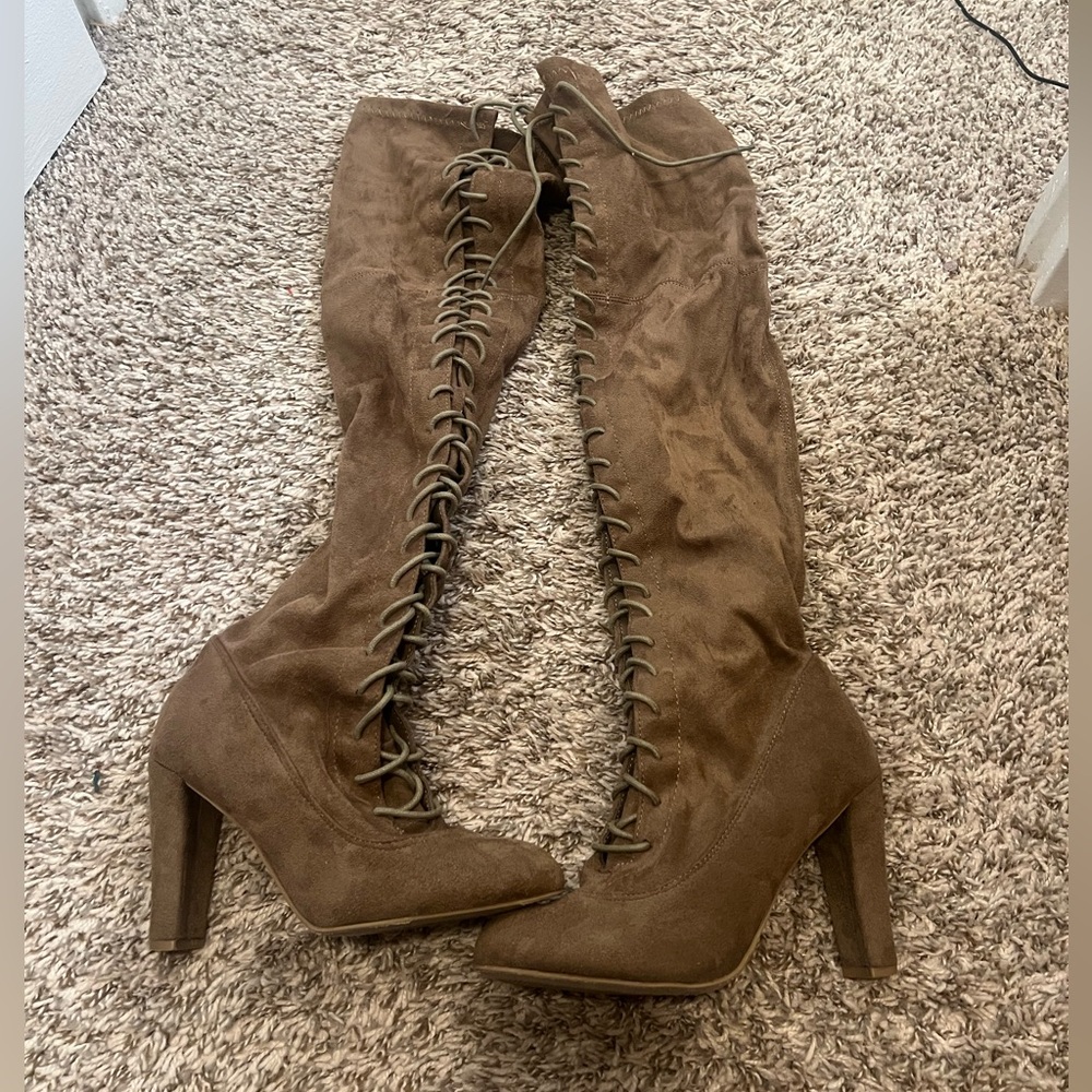 Laced up knee high boots heeled